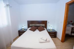 Łóżko lub łóżka w pokoju w obiekcie Fuerte Apartment Great Location