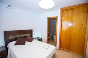 Łóżko lub łóżka w pokoju w obiekcie Fuerte Apartment Great Location