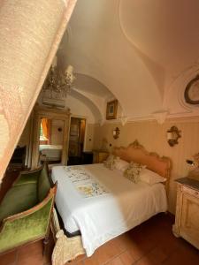 En eller flere senger på et rom på Ai Savoia B&B - Guest House