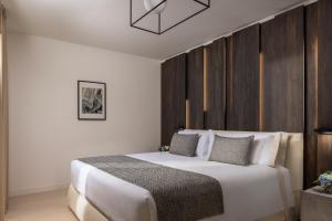 Postel nebo postele na pokoji v ubytování Tivoli Portopiccolo Sistiana Apartments