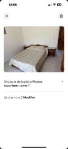 a bedroom with a bed in a room at Villa des écuries BENARD in Sainte-Suzanne