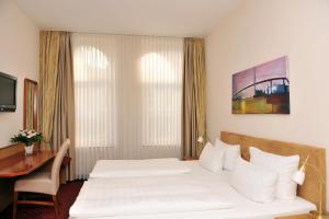 Postel nebo postele na pokoji v ubytování Hotel Fürst Bismarck