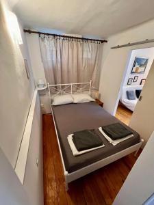 Postel nebo postele na pokoji v ubytování Nugal Apartment