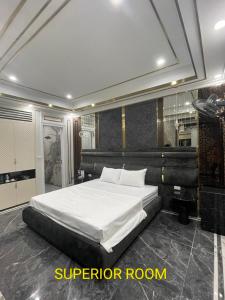 a bedroom with a large white bed in a room at Bao Ngọc Hotel Dương Nội in Hanoi +16 photos