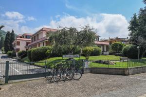 a group of bikes parked next to a fence at Favola Bella The panoramic penthouse in Bardolino