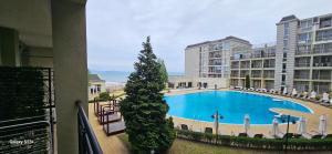 a view of a swimming pool in a building at Частно студио в комплекс Поморие Ризорт in Pomorie