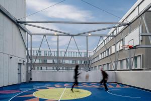 two people playing basketball on a basketball court at aparto Milan Ripamonti in Milan