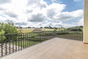 a balcony with a fence and a view of a field at Casa ponet in Solsona