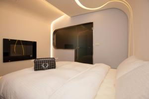 Voodi või voodid majutusasutuse Ya Nold Hot Spring Hotel toas