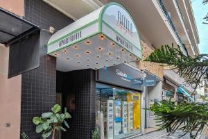 a store front with a sign for a pharmacy at Aparthotel AMMI Nice Lafayette in Nice
