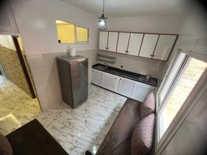 an overhead view of a kitchen with a refrigerator at مارتيل in Martil