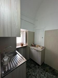 a small kitchen with a sink and a counter at Angel House in Locorotondo +16 photos