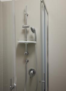 a shower in a bathroom with a glass door at Hotel Sole in Cannero Riviera