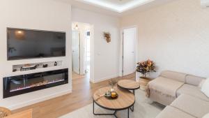 a living room with a couch and a fireplace at Villa Turística Palomas Torrox by Ruralidays in Torrox