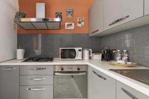 Kuchyňa alebo kuchynka v ubytovaní Consolata 7 Apartment