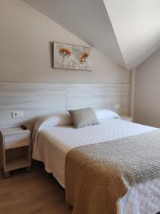 Un pat sau paturi într-o cameră la Hostal Paz