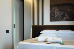 Ένα ή περισσότερα κρεβάτια σε δωμάτιο στο Rumi Boutique Hotels&Spa Only adults