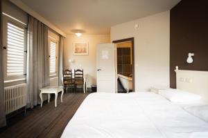 Postel nebo postele na pokoji v ubytování Thermae Grimbergen Hotel
