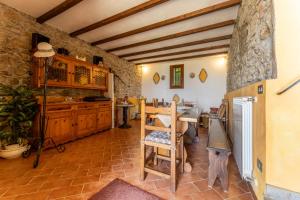 a kitchen with a table and a dining room at La Casa Di Elda, Holiday Home With Pool, Uzzano, Toscana in Uzzano