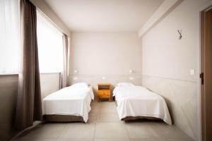 Postel nebo postele na pokoji v ubytování Thermae Grimbergen Hotel