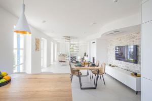 a kitchen and dining room with a table and chairs at Incredibly beautiful Stone House Villa Lota - Makarska Exklusiv in Bast