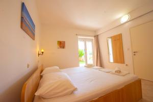 Postel nebo postele na pokoji v ubytování Apartments Cvito