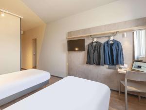 Posteľ alebo postele v izbe v ubytovaní Ibis Budget Mont De Marsan