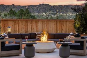 a patio with a couch and a fire pit at Cambria Hotel Burbank Airport in Burbank