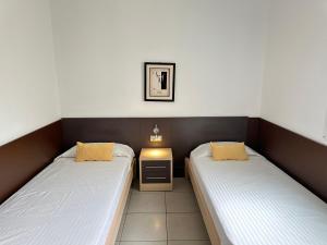 Postel nebo postele na pokoji v ubytování Agi Drugstore Apartments