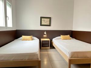 Postel nebo postele na pokoji v ubytování Agi Drugstore Apartments