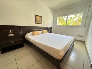 Postel nebo postele na pokoji v ubytování Agi Drugstore Apartments