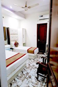 Postel nebo postele na pokoji v ubytování Hotel Crystal Deluxe at New Delhi Railway Station