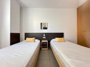 Postel nebo postele na pokoji v ubytování Agi Drugstore Apartments