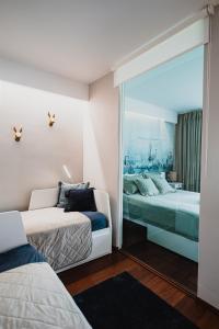 เตียงในห้องที่ Butique Apartman Grand
