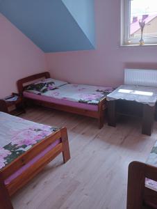 A bed or beds in a room at Villa pod gruszą