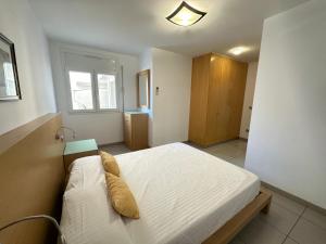 Postel nebo postele na pokoji v ubytování Agi Drugstore Apartments