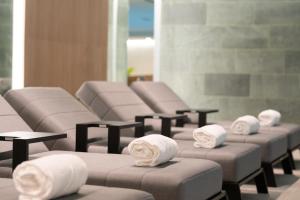 a row of massage chairs with towels on them at Hotel LIVVO Puerto de Mogán in Puerto de Mogán