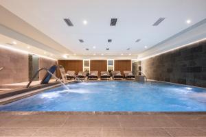 a pool in a hotel room with a water slide at Hotel LIVVO Puerto de Mogán in Puerto de Mogán