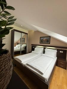 Ліжко або ліжка в номері Atrium