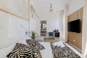 Postel nebo postele na pokoji v ubytování New Elegance Suites Guesthouse