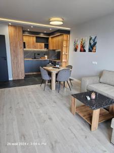 a living room with a couch and a table at Dilyanka 2 in Pernik +13 photos