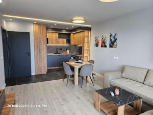a living room with a couch and a table at Dilyanka 2 in Pernik
