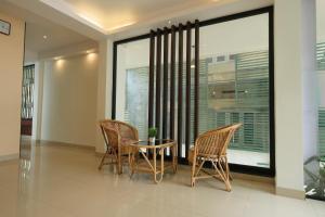 Posezení v ubytování Thekkady Gavi Suites