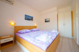 Postel nebo postele na pokoji v ubytování Apartments Cvito