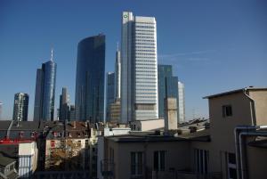 a city with tall buildings and tall buildings at Five Elements Hostel Frankfurt in Frankfurt