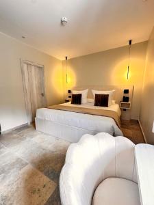 מיטה או מיטות בחדר ב-AlliOli Boutique Hotel Spa