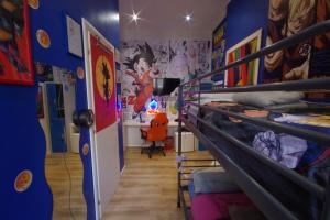 a room with a bunk bed with blue walls at Comics Guesthouse Hostel in Rome