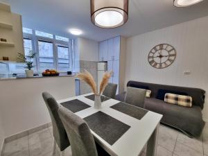 a kitchen and dining room with a table and chairs at Apartment Anka in Omiš