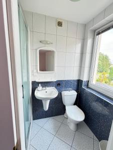 Kúpeľňa v ubytovaní Domino Dom Gościnny