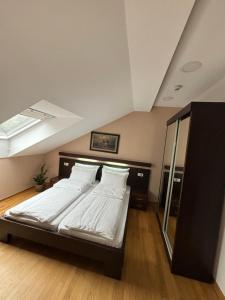 Ліжко або ліжка в номері Atrium